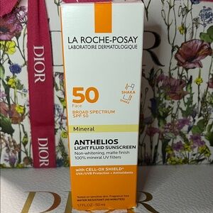 Anthelios Light Fluid Sunscreen SPF 50 - Orange and White